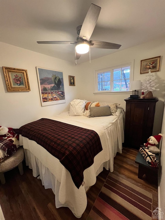 bedroom with ceiling fan and dark hardwood / wood-style flooring