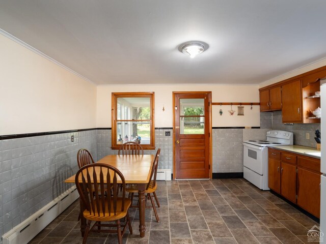 kitchen featuring baseboard heating, electric stove, tile walls, and ornamental molding