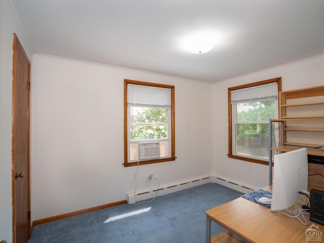 unfurnished office with dark colored carpet, plenty of natural light, crown molding, and a baseboard heating unit