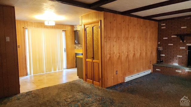 interior space with wooden walls, light colored carpet, beamed ceiling, and baseboard heating