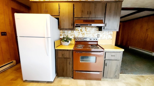 kitchen with ventilation hood, white fridge, a baseboard heating unit, and range