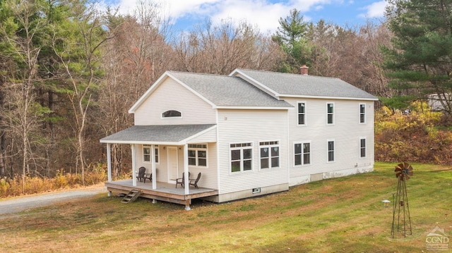 view of front facade with a porch and a front lawn