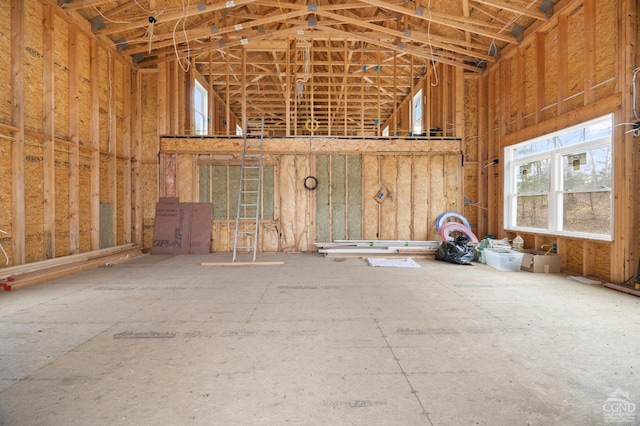 miscellaneous room with high vaulted ceiling