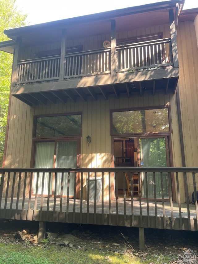 back of house with a balcony