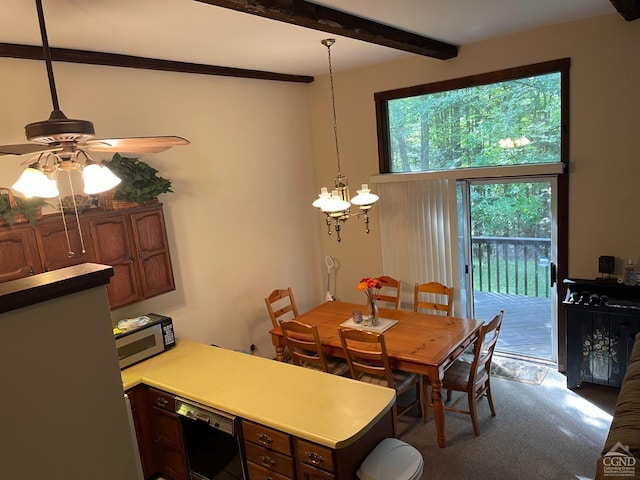 dining room featuring beam ceiling, carpet, and ceiling fan with notable chandelier