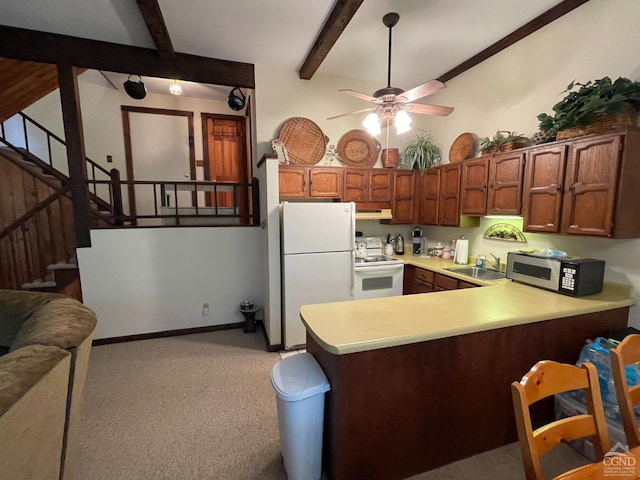 kitchen featuring beam ceiling, kitchen peninsula, ceiling fan, and white appliances