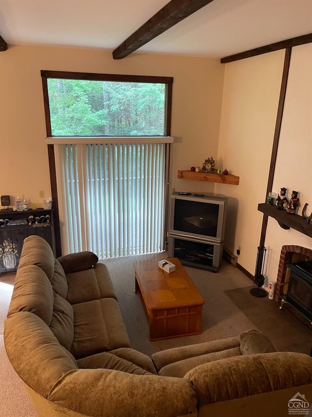 living room with carpet flooring, beamed ceiling, and a healthy amount of sunlight