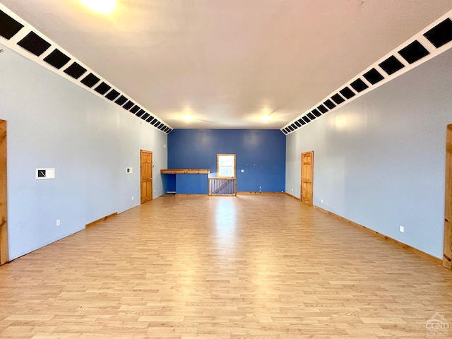 unfurnished living room featuring light wood-type flooring