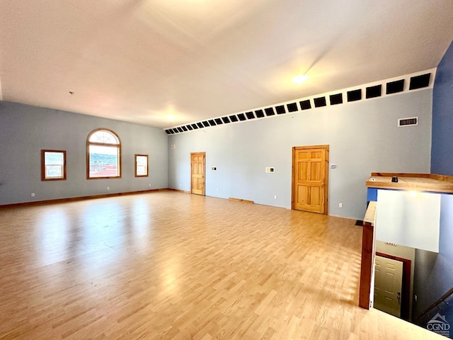 unfurnished living room featuring light wood-type flooring