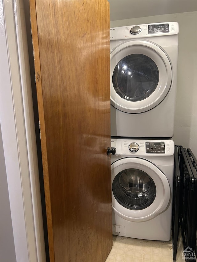 laundry room featuring stacked washer and clothes dryer