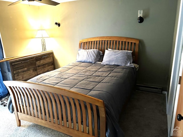 bedroom with baseboard heating, ceiling fan, and carpet