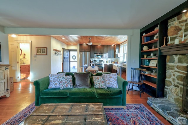 living room with hardwood / wood-style flooring and wood ceiling