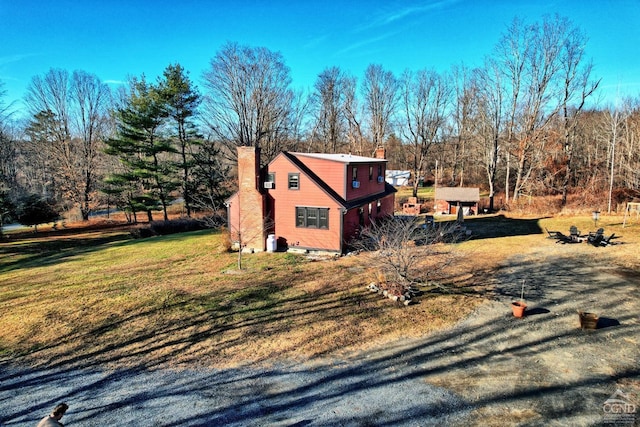 view of home's exterior with a lawn