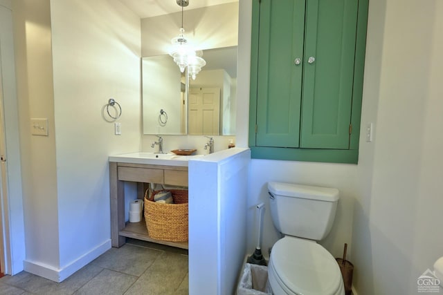 bathroom with tile patterned floors, vanity, and toilet