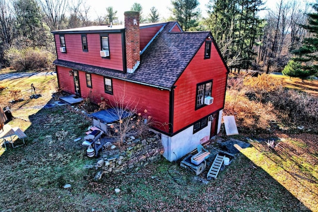 view of home's exterior featuring cooling unit