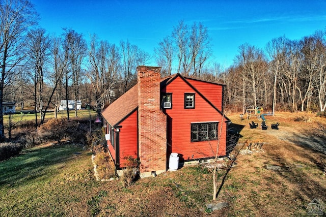 view of home's exterior featuring a lawn