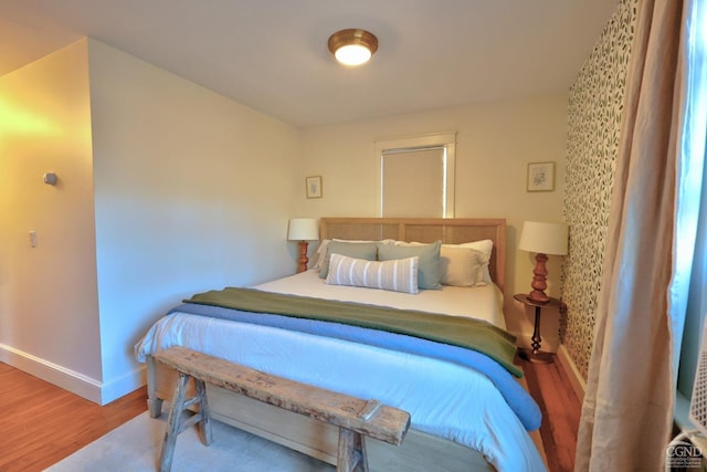 bedroom with wood-type flooring