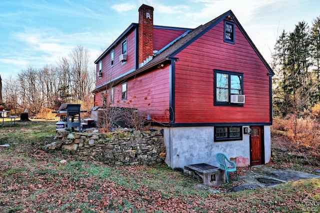 view of side of home featuring cooling unit