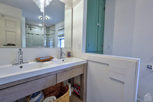 bathroom with vanity and a shower with door