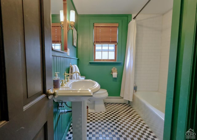 full bathroom with tile patterned floors, a wealth of natural light, shower / tub combo, and toilet