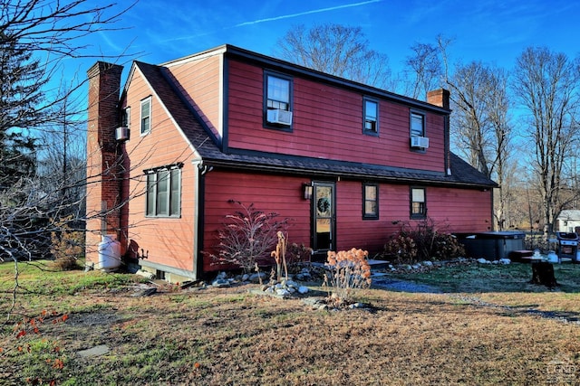 back of property with cooling unit