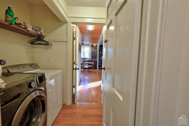 washroom featuring light hardwood / wood-style floors and independent washer and dryer