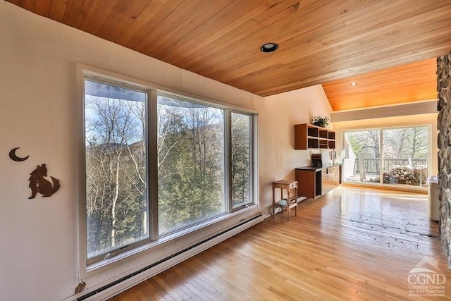 interior space featuring light hardwood / wood-style flooring, wood ceiling, vaulted ceiling, and a baseboard heating unit