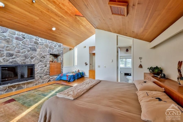 bedroom with a fireplace, hardwood / wood-style flooring, lofted ceiling, and wood ceiling