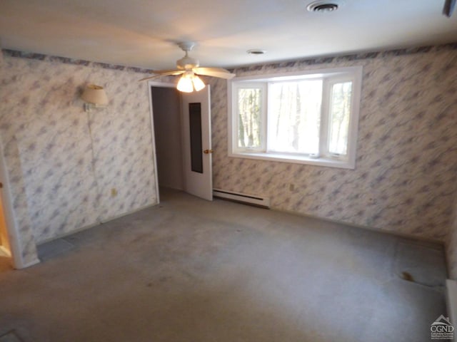 empty room featuring carpet flooring, a baseboard radiator, and ceiling fan