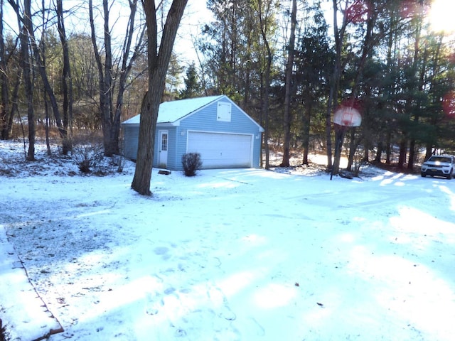 view of snow covered garage