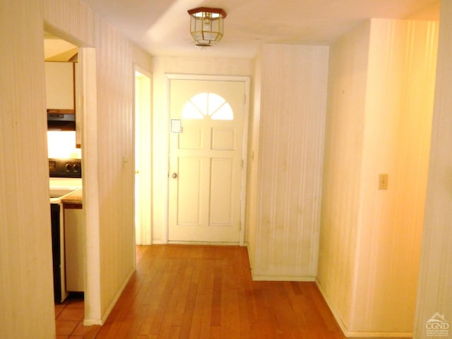 entryway with hardwood / wood-style flooring