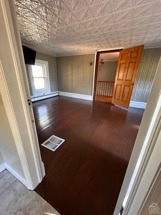 unfurnished room featuring wood-type flooring