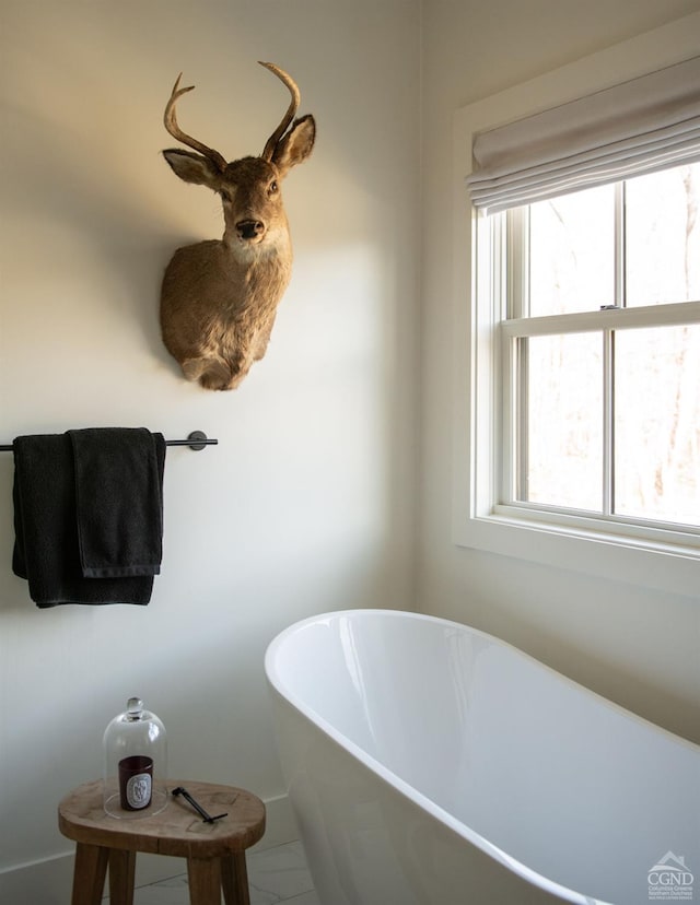 bathroom featuring a tub to relax in