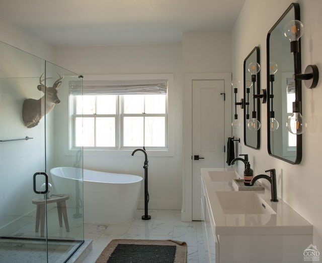 bathroom featuring vanity and independent shower and bath