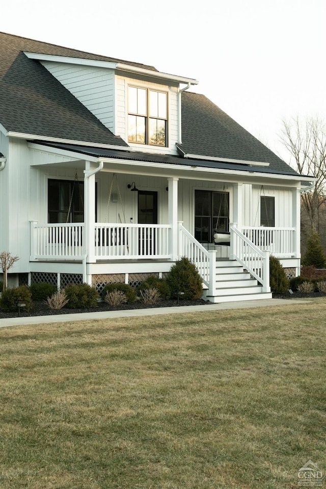 view of front of house featuring a porch and a front yard