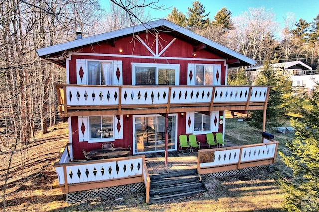 back of property featuring a deck