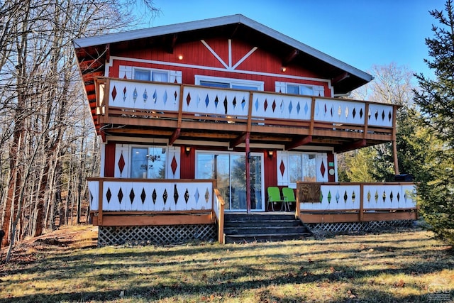 back of house featuring a wooden deck