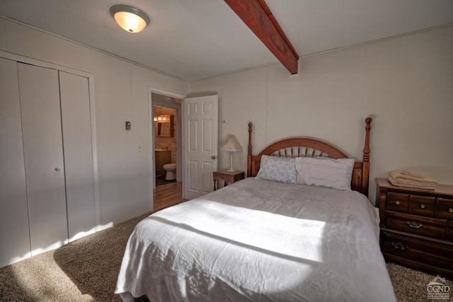 bedroom featuring carpet, a closet, and beamed ceiling