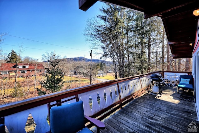 wooden terrace with a mountain view