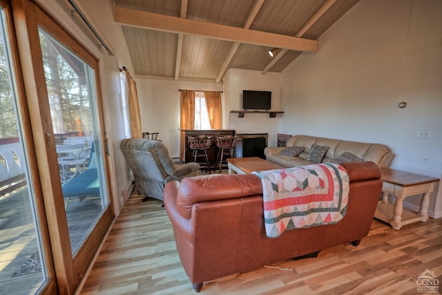 living room with wooden ceiling, lofted ceiling with beams, indoor bar, and light wood-type flooring