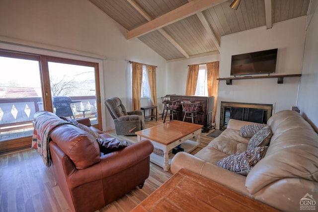 living room with beam ceiling, light hardwood / wood-style flooring, high vaulted ceiling, and wooden ceiling