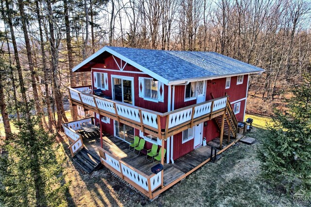 back of property with a wooden deck