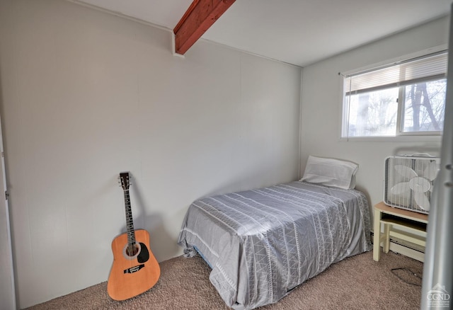 bedroom featuring beamed ceiling and carpet