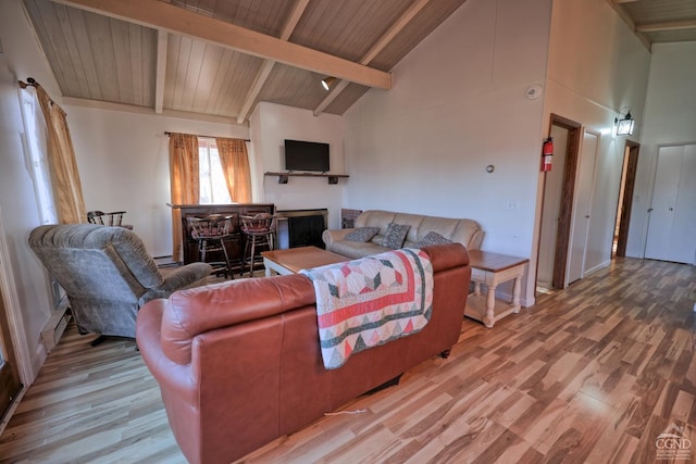 living room featuring beamed ceiling, bar area, high vaulted ceiling, and light hardwood / wood-style flooring