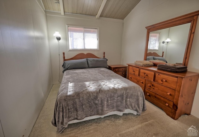 bedroom with carpet, wood ceiling, and vaulted ceiling