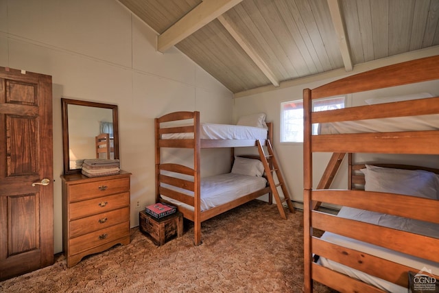 bedroom with dark colored carpet, vaulted ceiling with beams, and wooden ceiling