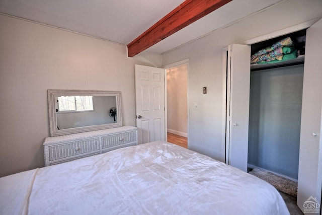 bedroom featuring beamed ceiling