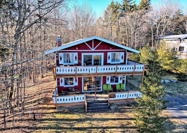 back of house featuring a deck