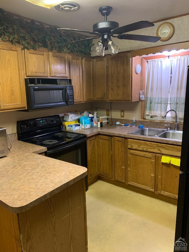 kitchen with kitchen peninsula, light carpet, ceiling fan, sink, and black appliances