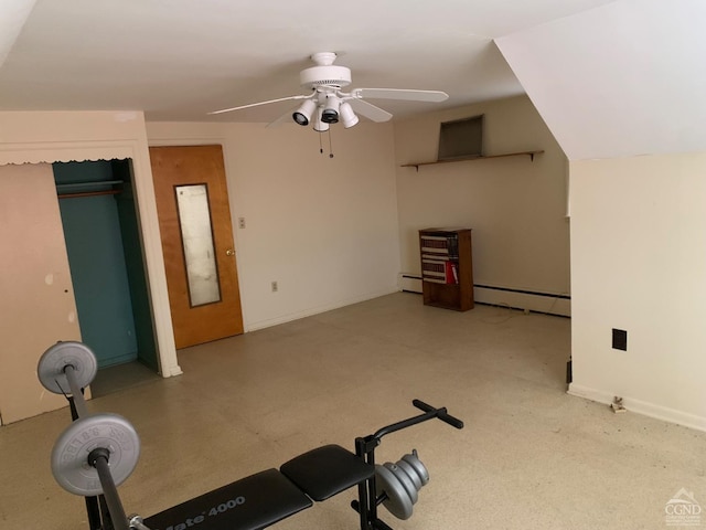 workout area featuring ceiling fan, lofted ceiling, and baseboard heating